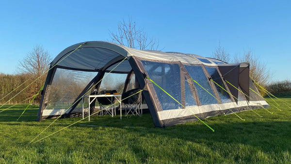 Photograph showing Delamere 6.0 6 man tent with canopy, groundsheet and carpet on grassy camp site khyam.