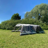 Photograph of Family 6 Steel Pole Tent - 6/8 Man Tent with canopy on grassy campsite in sunny weather. Khyam-made.